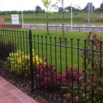 Palisade style iron vertical bar fence